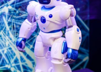 Contestants showcase AI personalities at a tech event, highlighting innovation and competition.