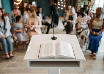 CFTC Chair speaks at podium during public forum on prediction markets regulation.