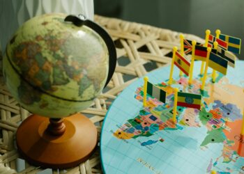 A digital representation of PayPal's PUSD stablecoin alongside a world map highlighting 70 countries.