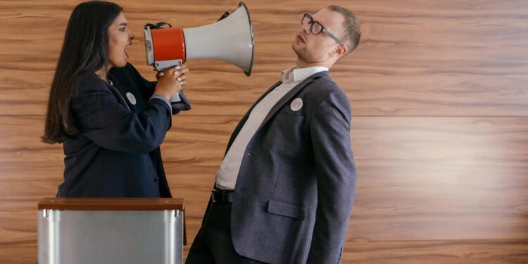 Michael Saylor speaking at a conference, passionately defending Bitcoin amidst growing criticisms.