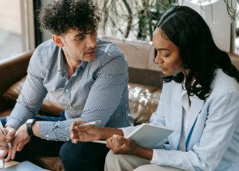 Meta executives discuss AI infrastructure partnership with Nebius in a modern office setting.