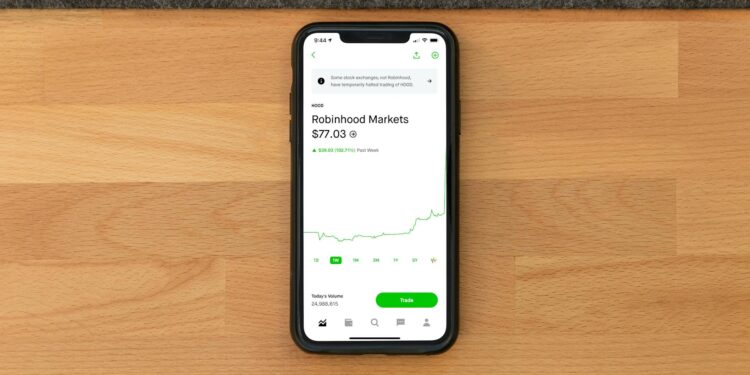 A stock market graph showing a downward trend with Robinhood's logo overlaid.