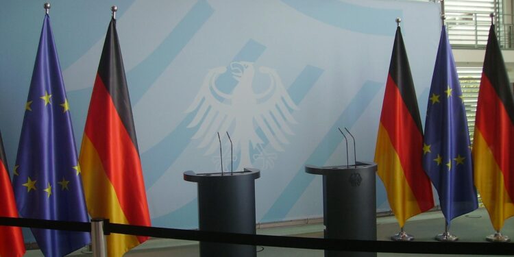 Logo of Anthropic displayed at a press conference on AI regulation debates.