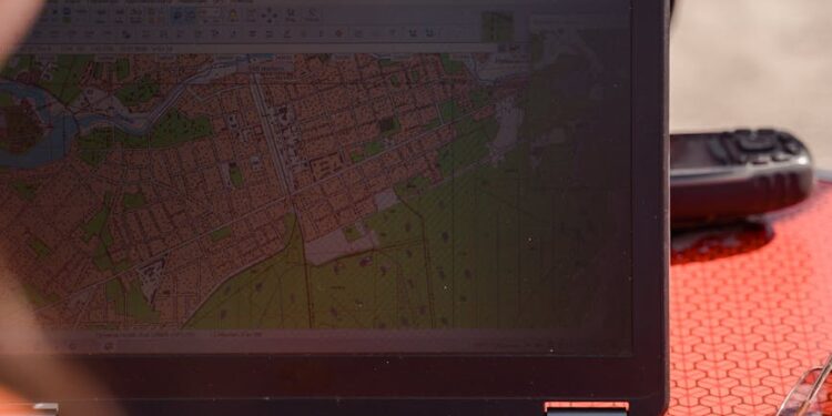 Military personnel analyzing maps and satellite images in a high-stakes planning session.