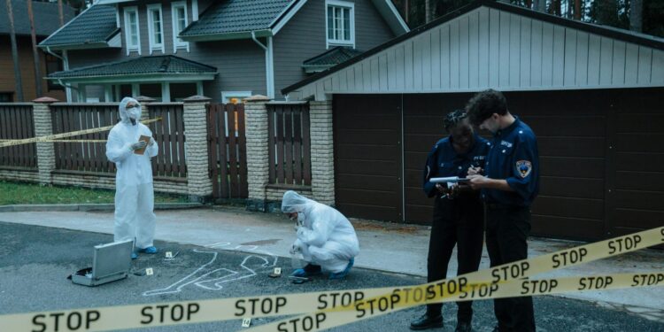 Police conducting an operation related to crypto kidnappings, with evidence bags and suspects.
