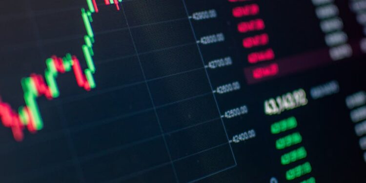 Bitcoin chart showing a steep decline, with a graphic representation of market volatility.