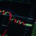 Chart showing Bitcoin price decline with downward trend line and bearish market indicators.