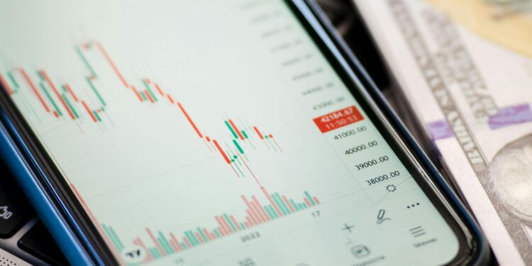 A chart showing a steep decline in RAVE token value amid financial news headlines.