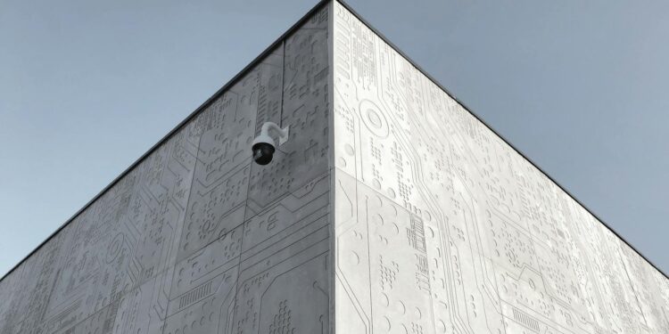 Coinbase building exterior with a digital asset custody security graphic overlay.