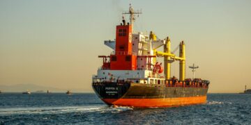 Iranian Revolutionary Guard vessels intercept commercial ships in the Strait of Hormuz.