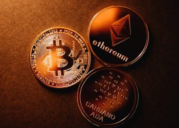 A graphic showing Cardano's logo alongside Bitcoin symbols and scaling charts.