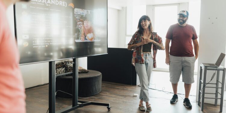 Cango team celebrates in front of a screen displaying Ecohash AI platform growth metrics.