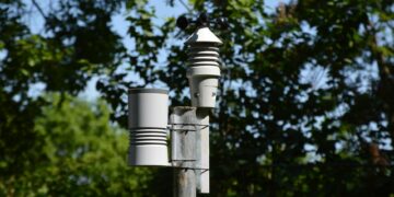 Weather sensor equipment displayed with police tools in a regulatory setting.