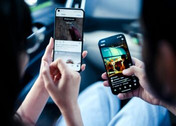 Person using Instagram Reels to shop with AI-enhanced social commerce features.