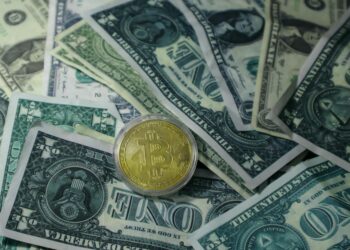 Stacks of cash and digital currency symbols reflecting financial negotiations with Iran.