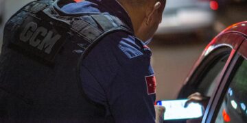 Regulators inspect a cryptocurrency trading hub during an enforcement operation.