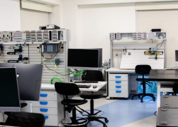 AI chips from Meta and Amazon stacked in a tech lab environment.