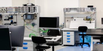 AI chips from Meta and Amazon stacked in a tech lab environment.