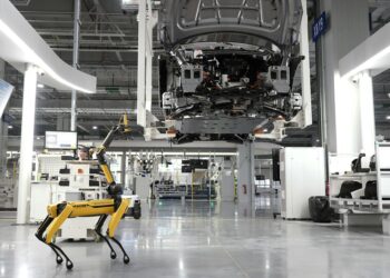 Workers assemble AI technology at the newly launched Nexus AI Factory in Morocco.
