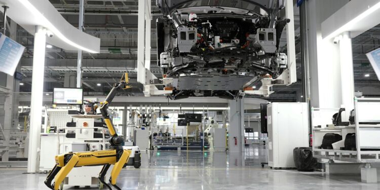 Workers assemble AI technology at the newly launched Nexus AI Factory in Morocco.