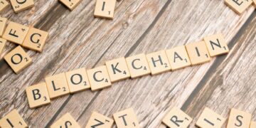 A digital illustration of a blockchain network with financial symbols and tokens.