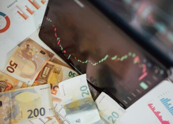 Graphic showing a digital stablecoin symbol with financial charts and currency icons.