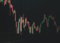 A visualization of a stock market decline with falling crypto graphs and Ether symbols.