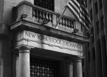 New York Attorney General at a podium announcing lawsuit against cryptocurrency exchanges.