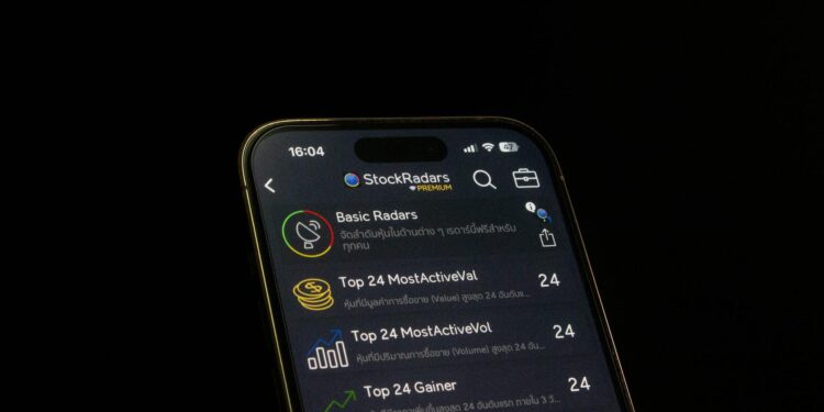 User interface of a fraudulent Ledger Live app with warning signs and money graphics.