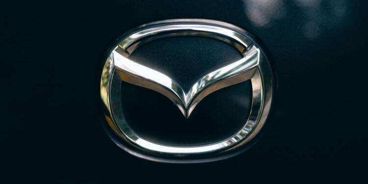 Polymarket logo displayed alongside La Liga emblem, symbolizing new betting partnership.