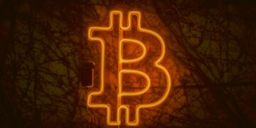 A digital representation of a Bitcoin symbol next to a warning sign indicating an error.