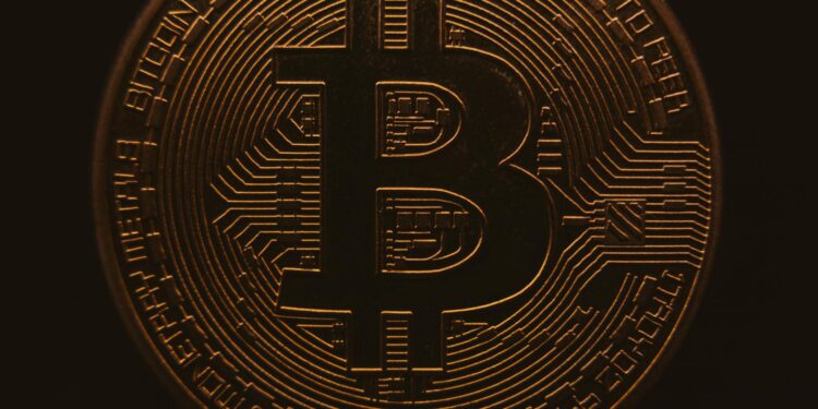 A digital illustration of a Bitcoin symbol bridging two blockchain networks for cross-chain transfers.