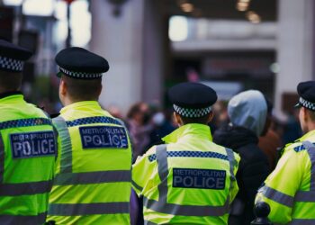 Law enforcement officers searching a London office linked to illegal crypto trading.