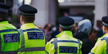 Law enforcement officers searching a London office linked to illegal crypto trading.