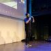Alex Mashinsky speaking at a fintech conference, highlighting crypto regulation issues.