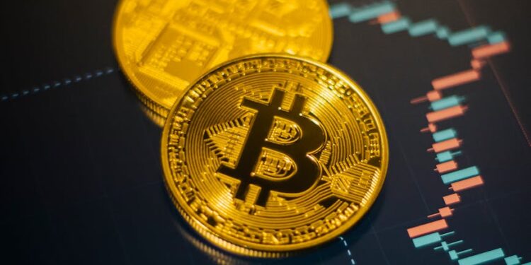 Bitcoin coins stacked with a declining graph overlay, symbolizing market volatility.