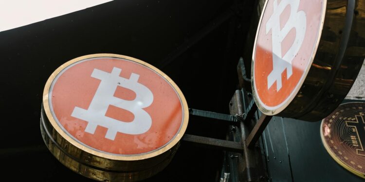 A shipping container with a digital cryptocurrency symbol and warning signs.