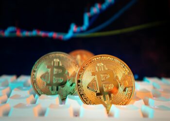 Crypto investors analyze charts with Trump-themed memecoins in the foreground.