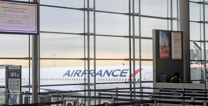 Passenger tampering with a weather sensor using a hair dryer at a Paris airport.