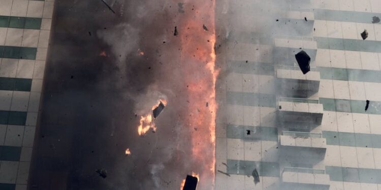 Fire and smoke billowing from a damaged oil pipeline in Saudi Arabia amid escalating regional tensions.