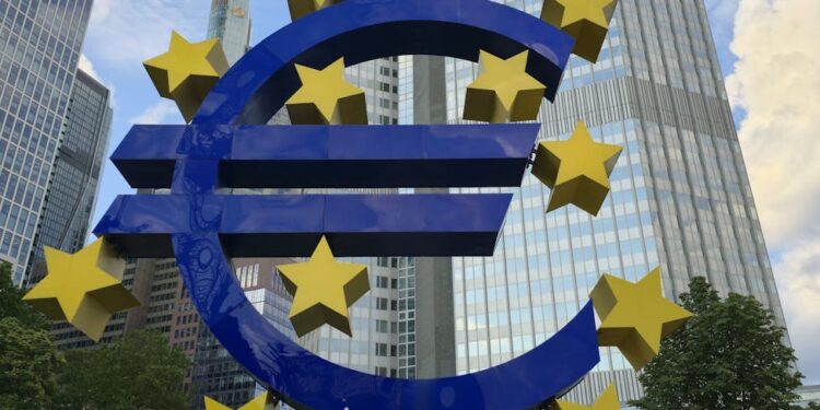 Central bank building with digital currency graphics overlay, symbolizing CBDC development.