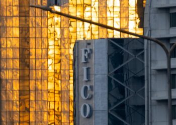 Oil tankers navigating the Strait, overlay of cryptocurrency symbols and toll signs.