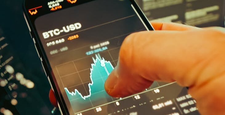 Hands shaking over a trading screen displaying crypto market trends and World Cup graphics.