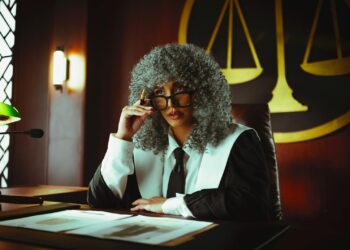 A courtroom scene showing regulatory officials discussing cryptocurrency prediction markets.