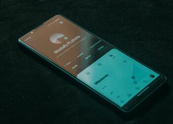 A digital representation of the USDCV stablecoin on a smartphone screen with MetaMask interface.