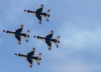 Graphic showing S&P logo alongside digital tokens and financial charts on a blockchain.