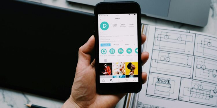 A smartphone displaying a fake Instagram account claiming to be Ripple's CEO.