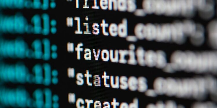 Computer screen displaying lines of code with a padlock symbol representing AI security concerns.