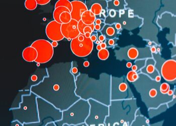 Binance logo overlaying a map of Ukraine, symbolizing investment in digital resilience.
