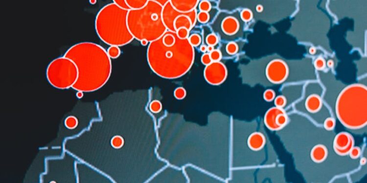 Binance logo overlaying a map of Ukraine, symbolizing investment in digital resilience.